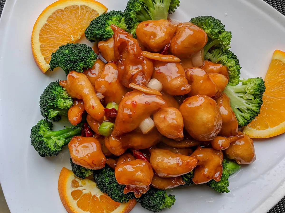 Sweet orange glazed chicken with fresh broccoli and orange slices at Home Flavor, a Chinese Restaurant in Largo
